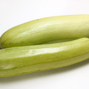 Two very healthy lebanese zucchini fruit on a white background.