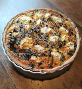 silverbeet quiche on old wooden table