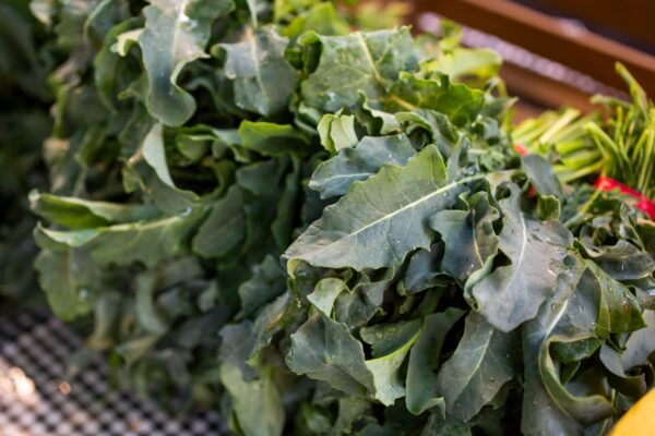 Image of Spigariello Leaf Broccoli, a Vegetable, in a bunch on a table.